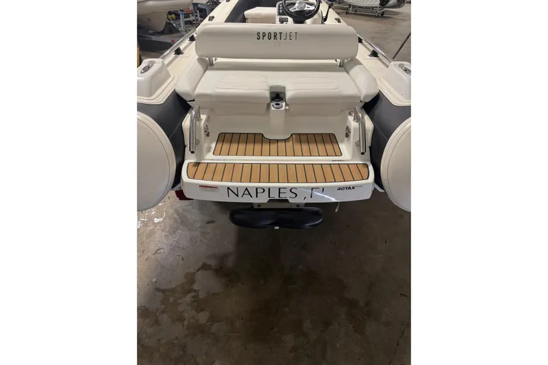 Slide: The Image of 2020 Williams Jet Tenders Sportjet 435, rear view, in a garage setting. - 9