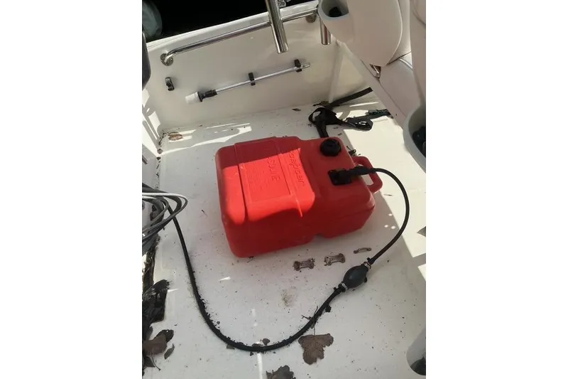 Slide: The Image of Red fuel tank on 2010 Boston Whaler 13 Dauntless boat deck. - 7