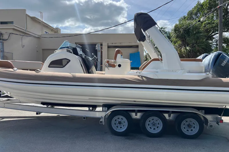 The Image of 2024 Zodiac Medline 9 boat on trailer, parked outdoors under cloudy sky. - 0