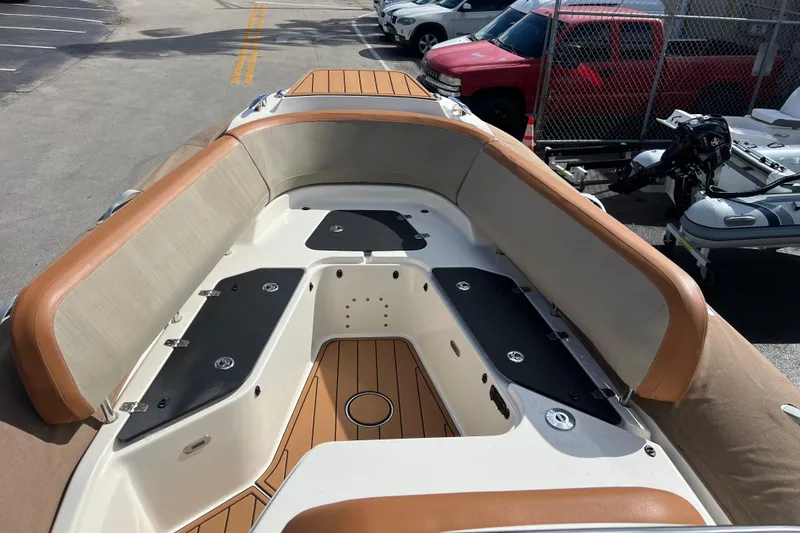 Slide: The Image of 2024 Zodiac Medline 9 boat interior with tan seating and wood accents. - 6