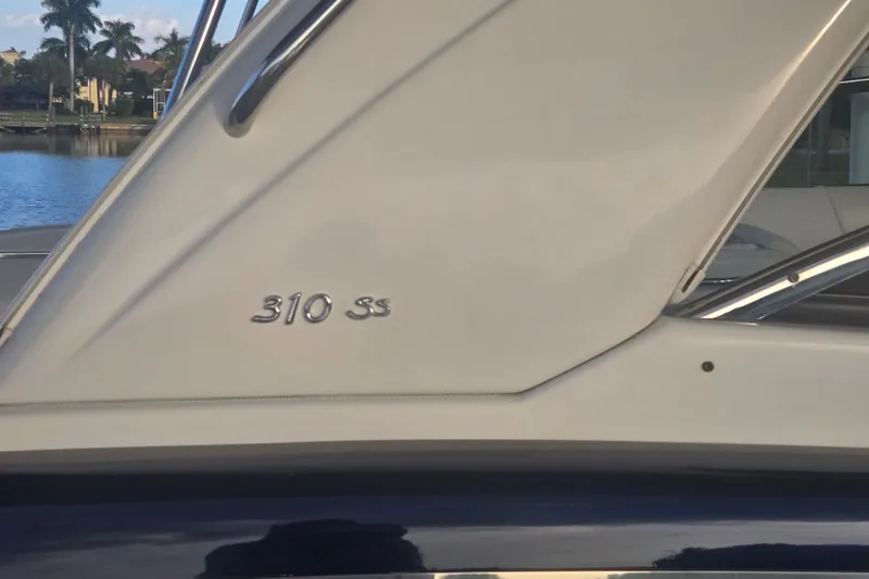 Slide: The Image of 2013 Formula 310 Sun Sport boat detail with "310 SS" emblem. - 10