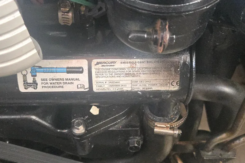 Slide: The Image of Engine label on a 2013 Formula 310 Sun Sport, detailing emission compliance and maintenance instructions. - 14