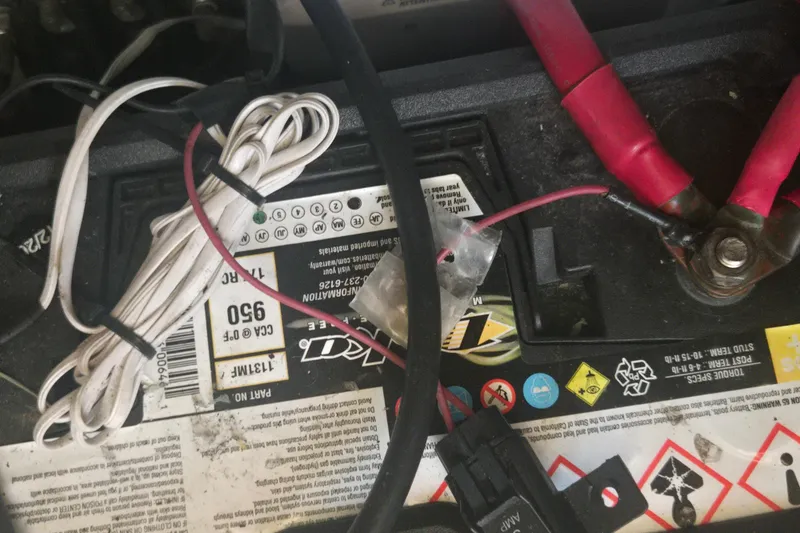 Slide: The Image of Battery setup with cables in a 2013 Formula 310 Sun Sport boat. - 16