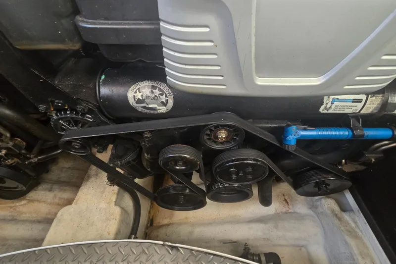 Slide: The Image of Engine compartment of a 2013 Formula 310 Sun Sport boat, showing belts and components. - 20