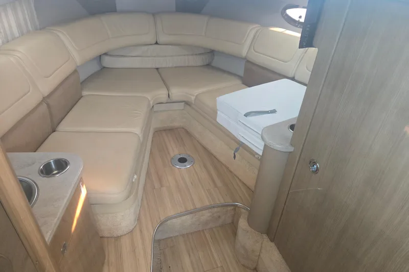 Slide: The Image of Interior of 2013 Formula 310 Sun Sport boat with beige seating and wood flooring. - 22