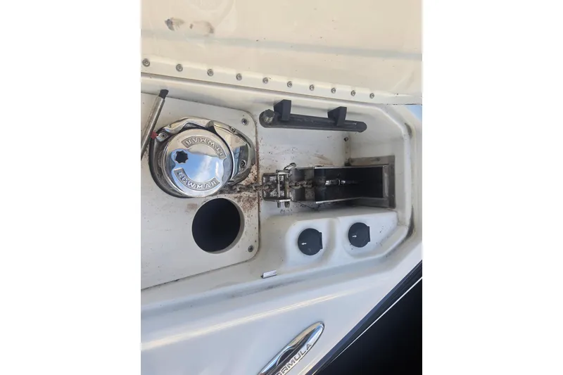 Slide: The Image of 2013 Formula 310 Sun Sport boat deck with anchor winch and controls. - 38