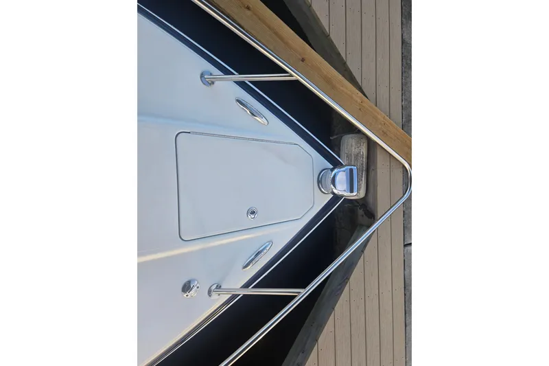 Slide: The Image of Bow of 2013 Formula 310 Sun Sport boat docked at a wooden pier. - 39