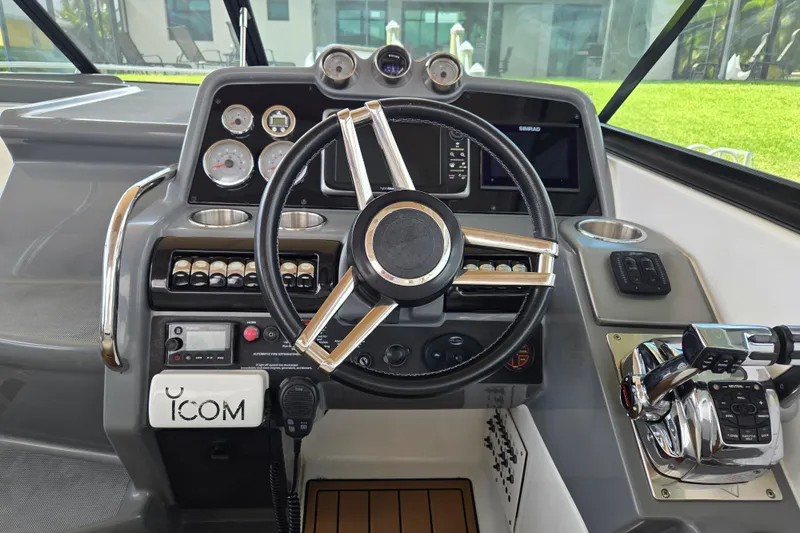 Slide: The Image of Steering console of a 2013 Formula 310 Sun Sport boat with modern controls. - 40