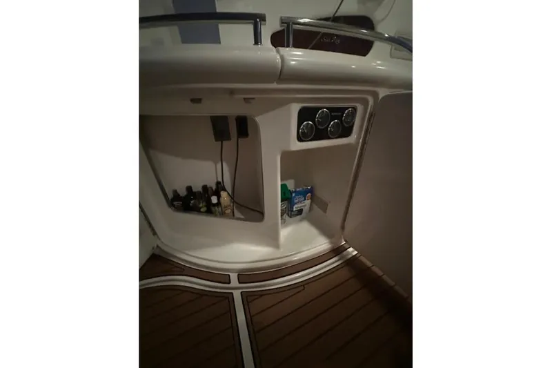 Slide: The Image of Interior storage compartment of 2000 Sea Ray Sundancer 540 yacht with wooden flooring. - 10