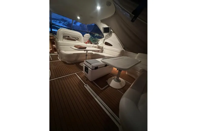 Slide: The Image of Luxurious interior of 2000 Sea Ray Sundancer 540 yacht with elegant seating and table. - 11