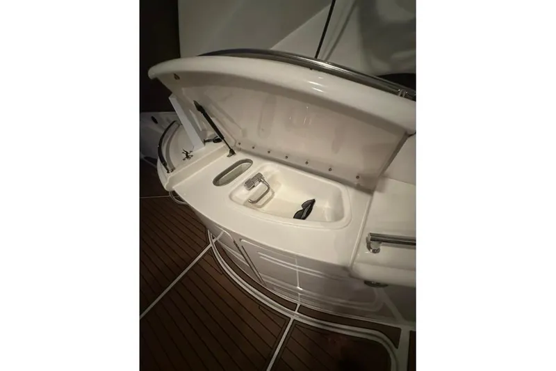 Slide: The Image of Wet bar on 2000 Sea Ray Sundancer 540 yacht, featuring sink and faucet. - 12