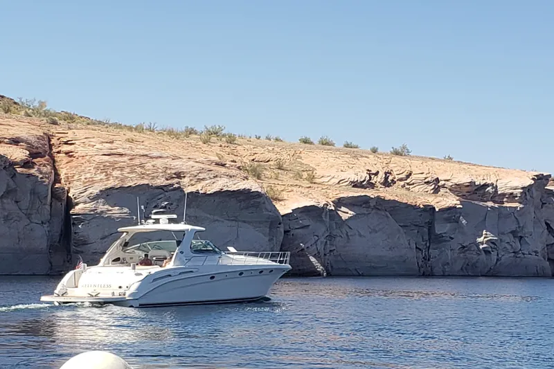 Slide: The Image of 2000 Sea Ray Sundancer 540 yacht named "Relentless" docked, rear view. - 8