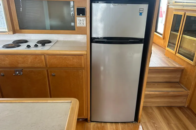 Slide: The Image of Kitchen area of a 1996 Navigator 53 Classic yacht with stove and fridge. - 13