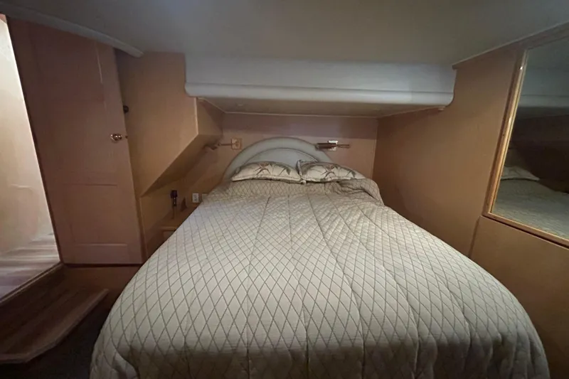 Slide: The Image of Cozy bedroom interior of 1996 Navigator 53 Classic yacht with quilted bedding. - 17