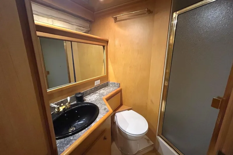 Slide: The Image of Bathroom interior of 1996 Navigator 53 Classic yacht with sink, toilet, and shower. - 19