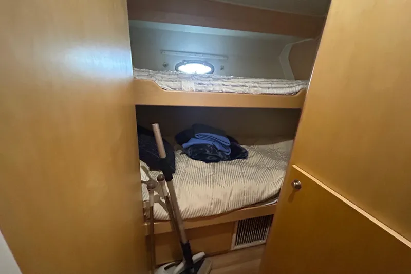 Slide: The Image of Bunk beds in 1996 Navigator 53 Classic yacht cabin with wooden interior. - 23