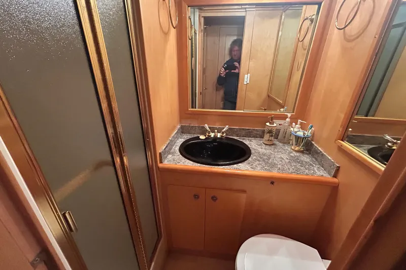 Slide: The Image of Bathroom interior of 1996 Navigator 53 Classic yacht with sink, mirror, and shower. - 25