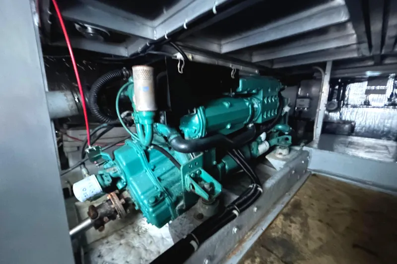 Slide: The Image of Engine room of a 1996 Navigator 53 Classic yacht, featuring a Volvo diesel marine engine. - 33