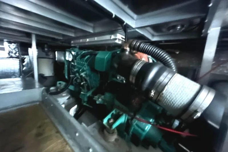 Slide: The Image of Engine compartment of a 1996 Navigator 53 Classic boat, showcasing mechanical components. - 34