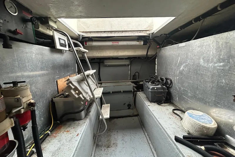 Slide: The Image of Engine room of a 1996 Navigator 53 Classic yacht, featuring equipment and storage. - 35