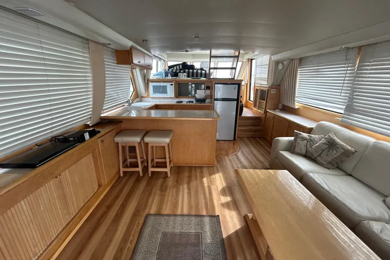 Slide: The Image of Interior of 1996 Navigator 53 Classic yacht with modern kitchen and cozy seating area. - 8