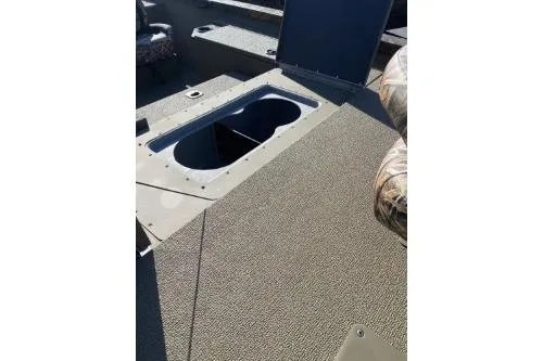 Slide: The Image of 2026 G3 Sportsman 1810 PFX boat interior with open storage compartment. - 6