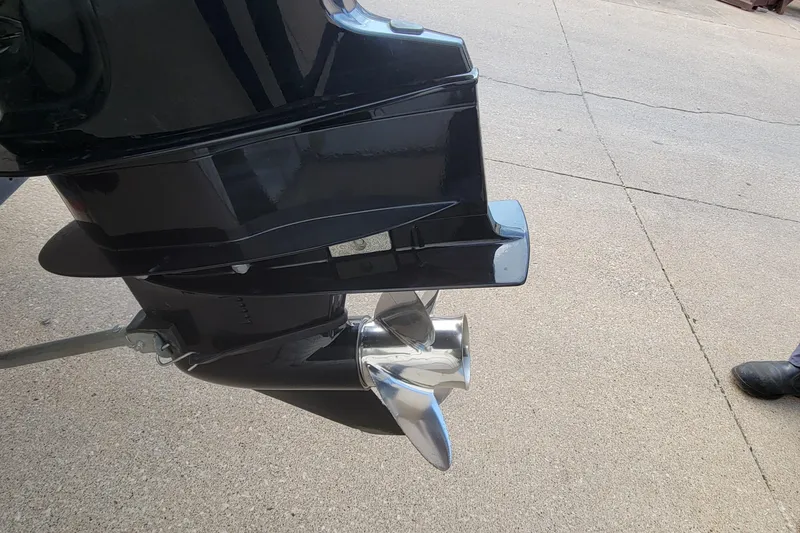 Slide: The Image of 2022 Crestliner 1750 Fish Hawk WT outboard motor and propeller on pavement. - 13