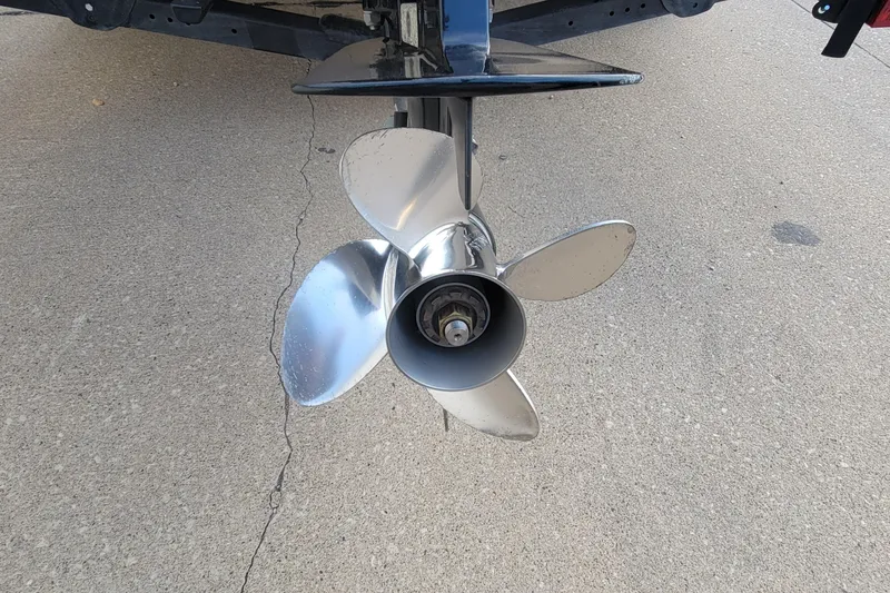 Slide: The Image of 2022 Crestliner 1750 Fish Hawk WT boat propeller on concrete surface. - 14