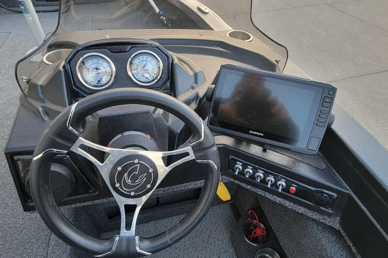 Slide: The Image of 2022 Crestliner 1750 Fish Hawk WT dashboard with steering wheel and Garmin display. - 20