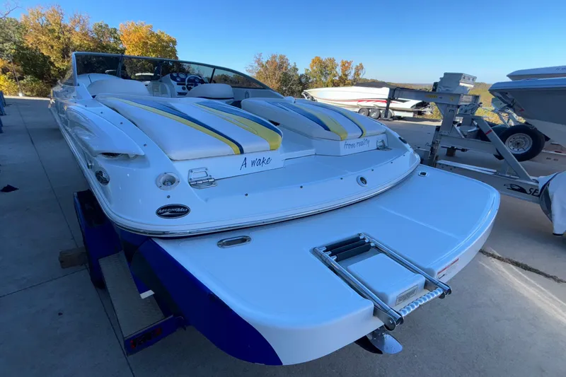 Slide: The Image of 2008 Baja 277 Islander boat with sleek design and vibrant seating on a trailer. - 10