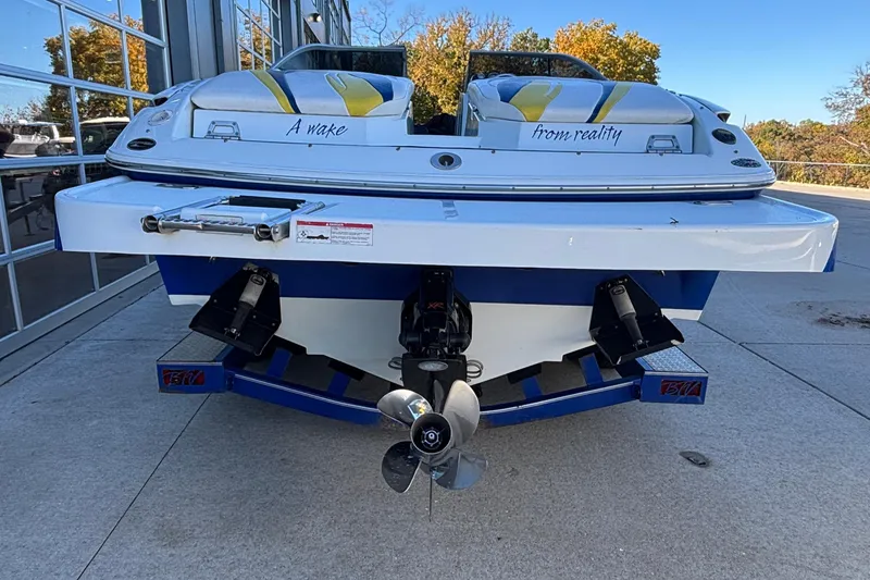 Slide: The Image of 2008 Baja 277 Islander boat rear view with dual engines and colorful seating. - 14