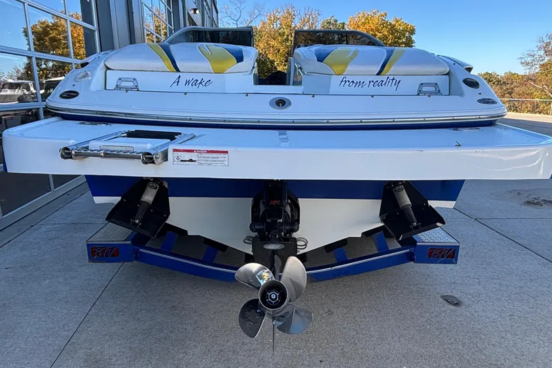 Slide: The Image of Rear view of a 2008 Baja 277 Islander boat with dual engines and custom seating. - 15
