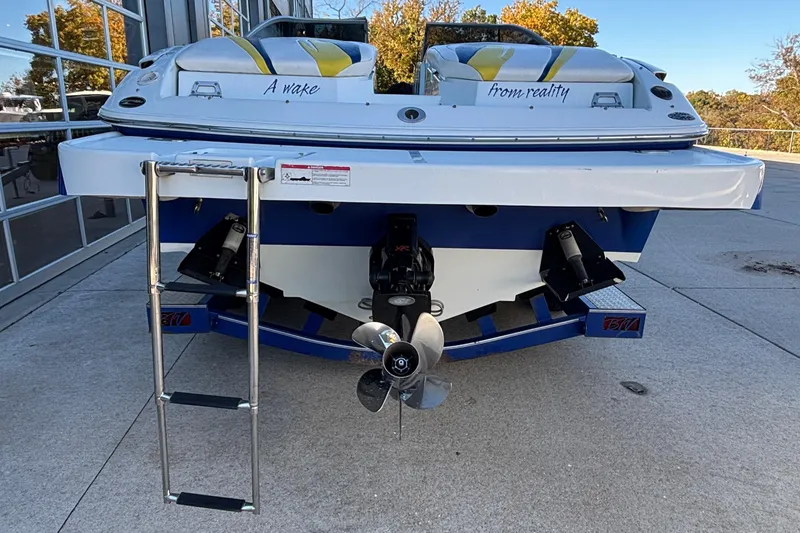 Slide: The Image of 2008 Baja 277 Islander boat rear view with ladder and dual propellers. - 16
