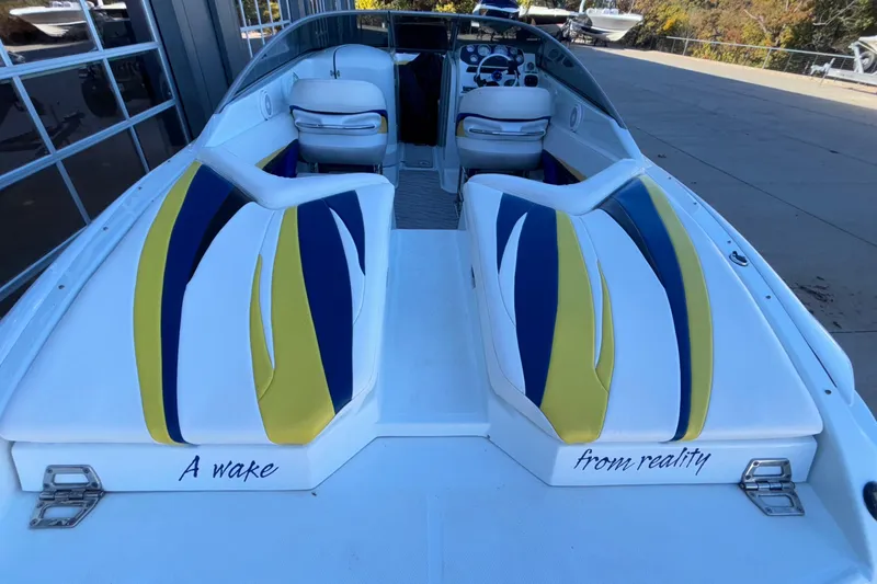 Slide: The Image of 2008 Baja 277 Islander boat with colorful seating and "A wake from reality" text. - 18