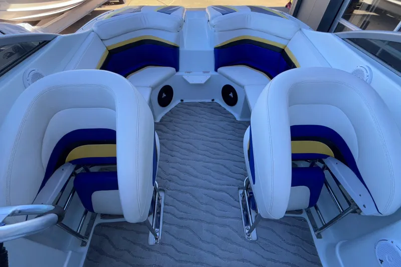 Slide: The Image of 2008 Baja 277 Islander boat interior with white, blue, and yellow seating. - 20