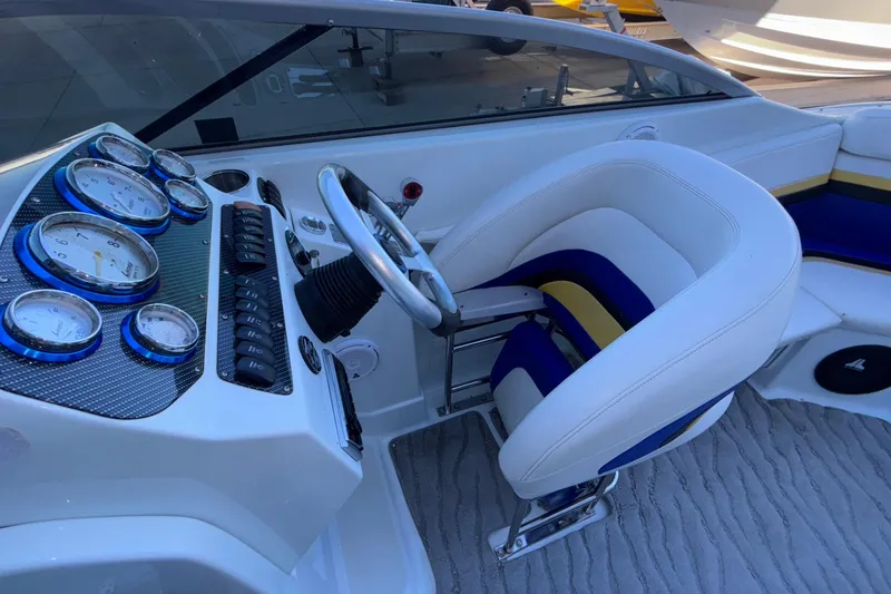 Slide: The Image of 2008 Baja 277 Islander boat cockpit with gauges and steering wheel. - 21