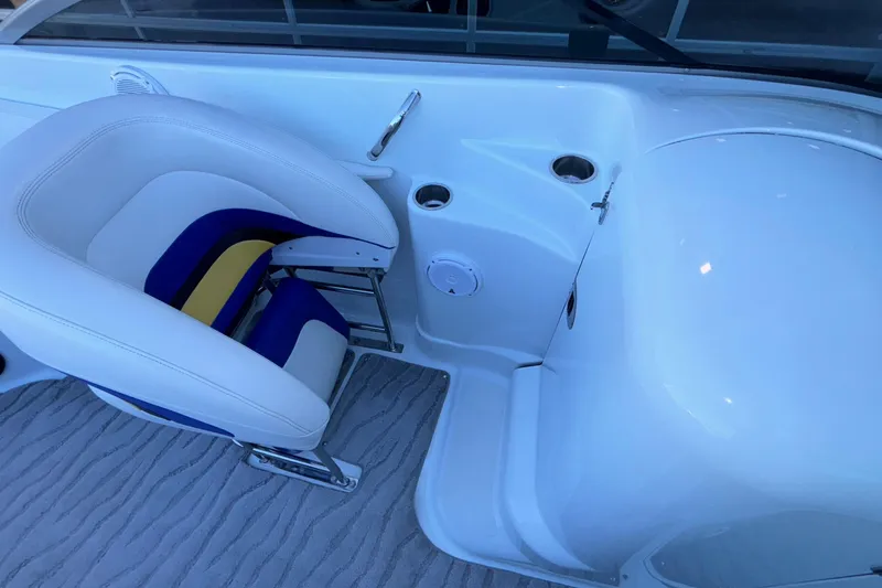 Slide: The Image of 2008 Baja 277 Islander boat interior with white and blue seating. - 22