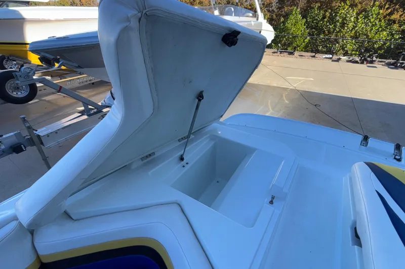 Slide: The Image of Open storage compartment on a 2008 Baja 277 Islander boat, showcasing interior space. - 27