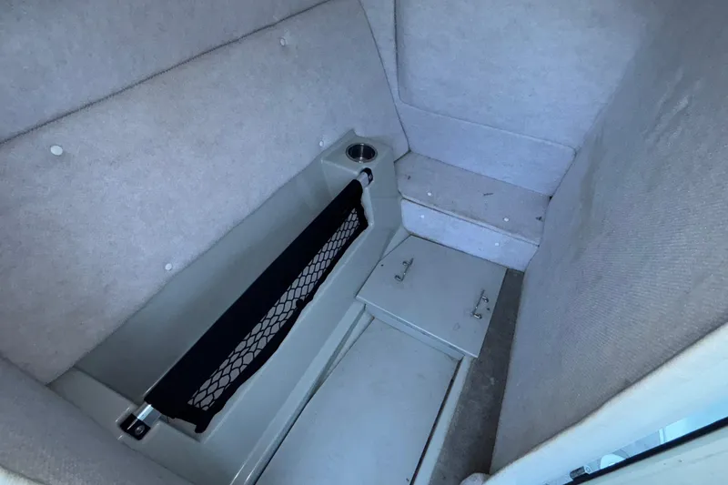 Slide: The Image of 2008 Baja 277 Islander cabin interior with storage and seating area. - 29