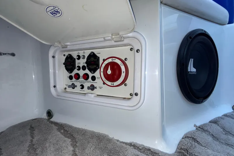 Slide: The Image of Control panel and speaker on a 2008 Baja 277 Islander boat interior. - 32