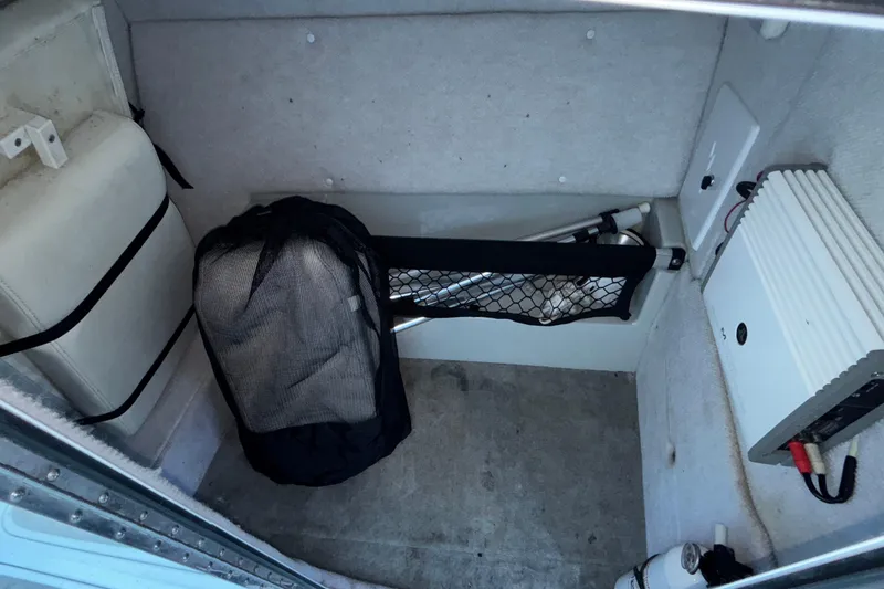 Slide: The Image of Interior storage of 2008 Baja 277 Islander boat with equipment and netting. - 48
