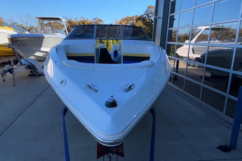 Slide: The Image of 2008 Baja 277 Islander boat in storage, front view, with other boats nearby. - 5