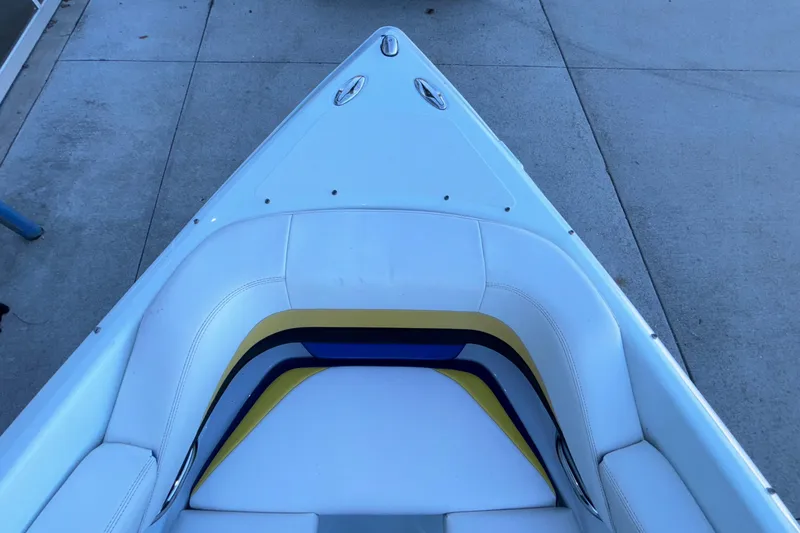 Slide: The Image of 2008 Baja 277 Islander boat bow with colorful seating on concrete surface. - 50