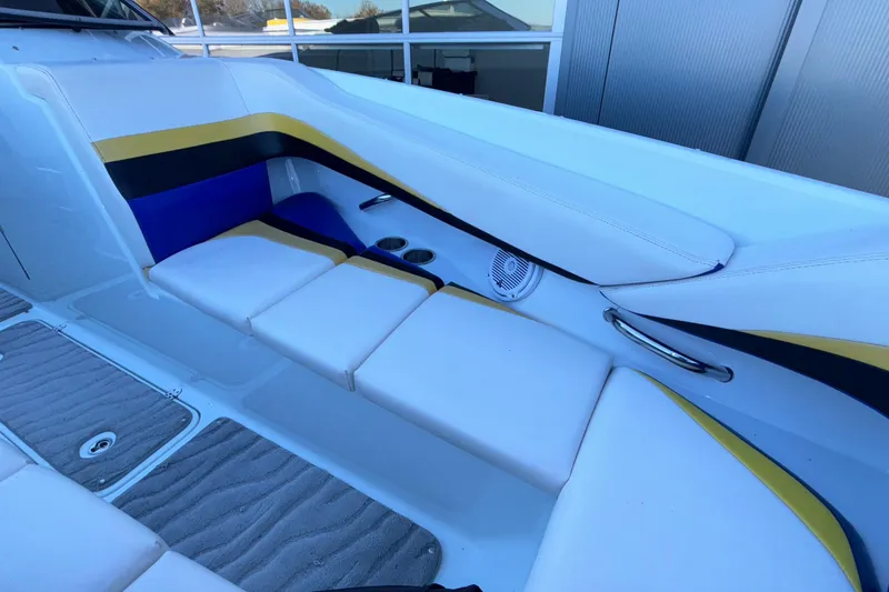 Slide: The Image of 2008 Baja 277 Islander boat interior with white, yellow, and blue seating. - 51