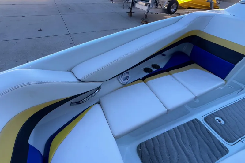 Slide: The Image of 2008 Baja 277 Islander boat interior with colorful seating and cup holders. - 52
