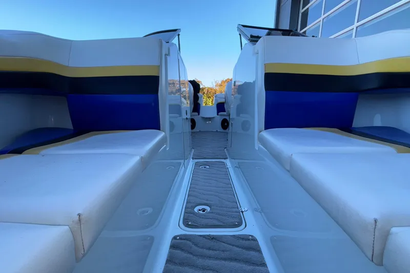 Slide: The Image of 2008 Baja 277 Islander boat interior with colorful seating and open deck view. - 53