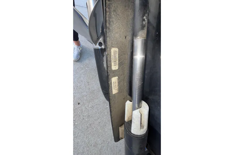 Slide: The Image of Close-up of a 2008 Baja 277 Islander boat component with visible labels and hydraulic part. - 9