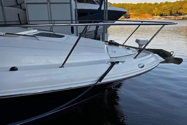Slide: The Image of 2005 Sea Ray 340 Sundancer yacht docked on calm water. - 10