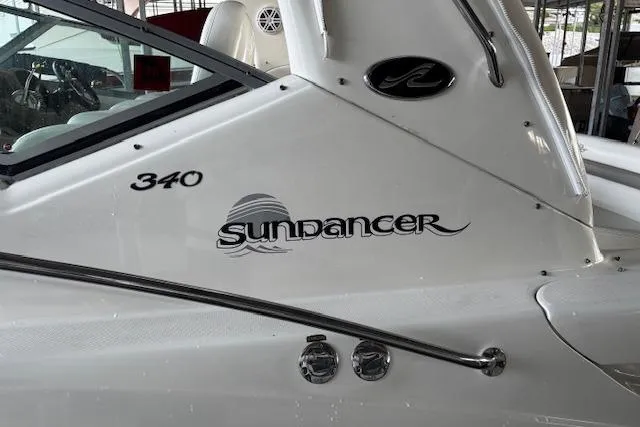 Slide: The Image of 2005 Sea Ray 340 Sundancer boat, white exterior with model name and logo visible. - 14