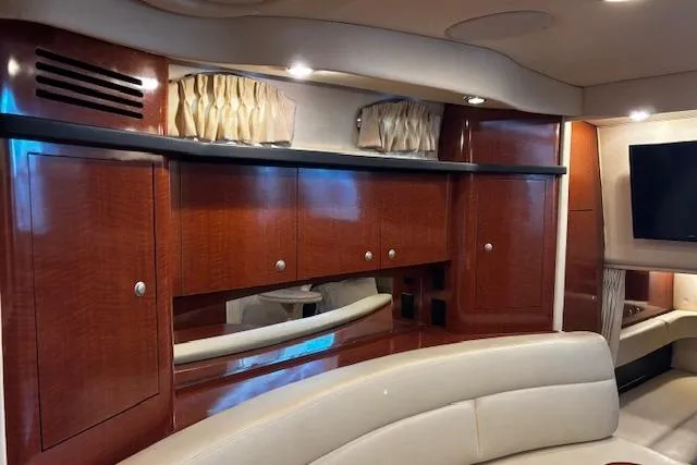 Slide: The Image of Interior of 2005 Sea Ray 340 Sundancer with elegant wood cabinetry and modern seating. - 18